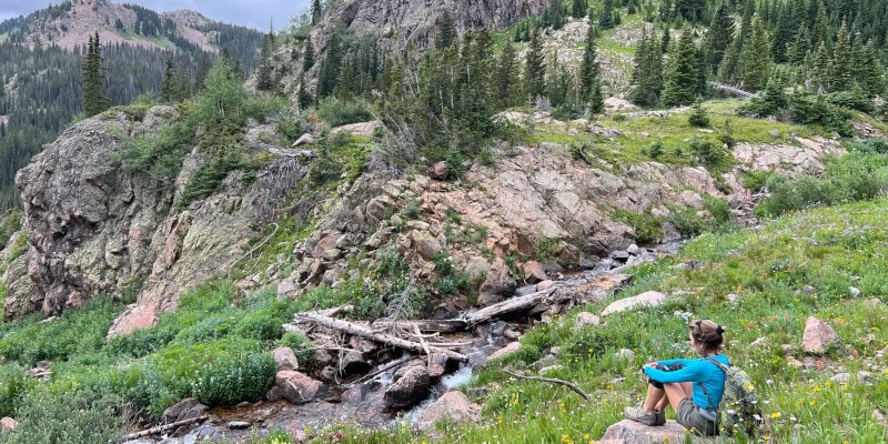 Diane on hike looking at landscapde